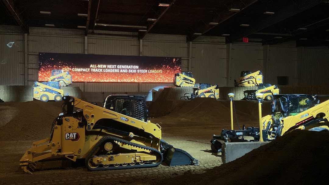 Caterpillar's new skid steer loaders and compact track loaders in a demo.