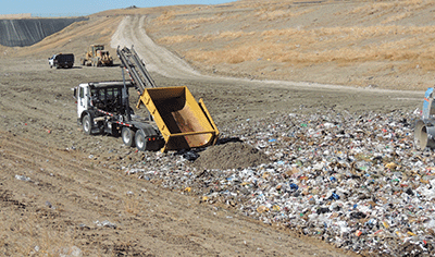Landfill compactor working in a landfill