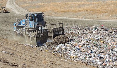 Landfill compactor working on landfill